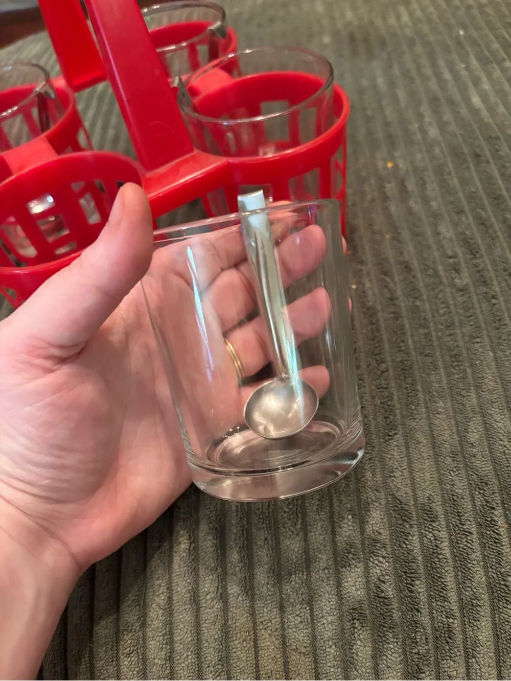 Crate & Barrel Red condiment caddy with four glass jars and metal spoons